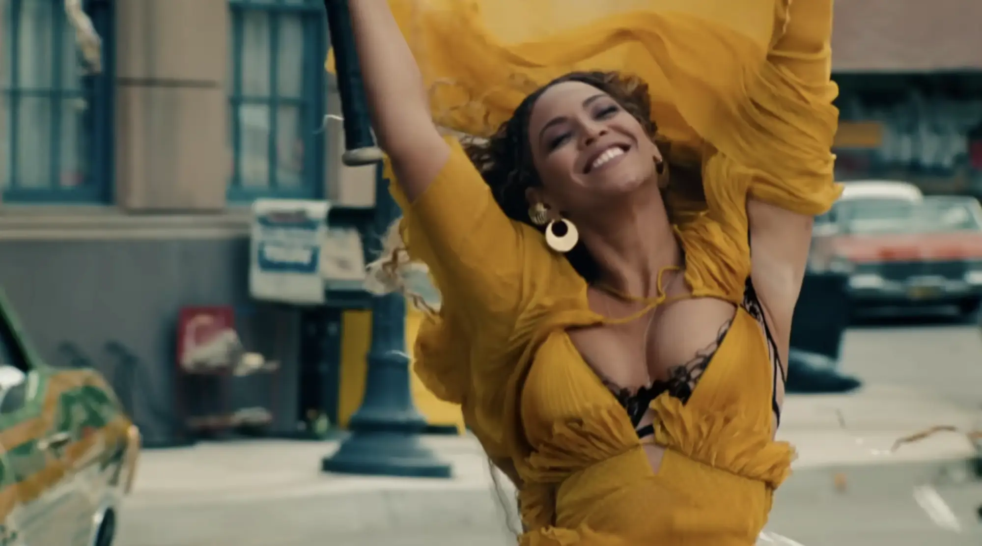 Beyoncé in the iconic yellow dress for Hold Up on Lemonade (2016).